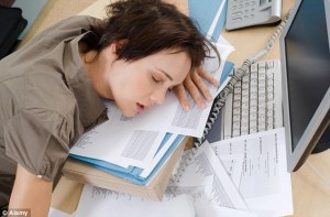 woman sleeping at desk
